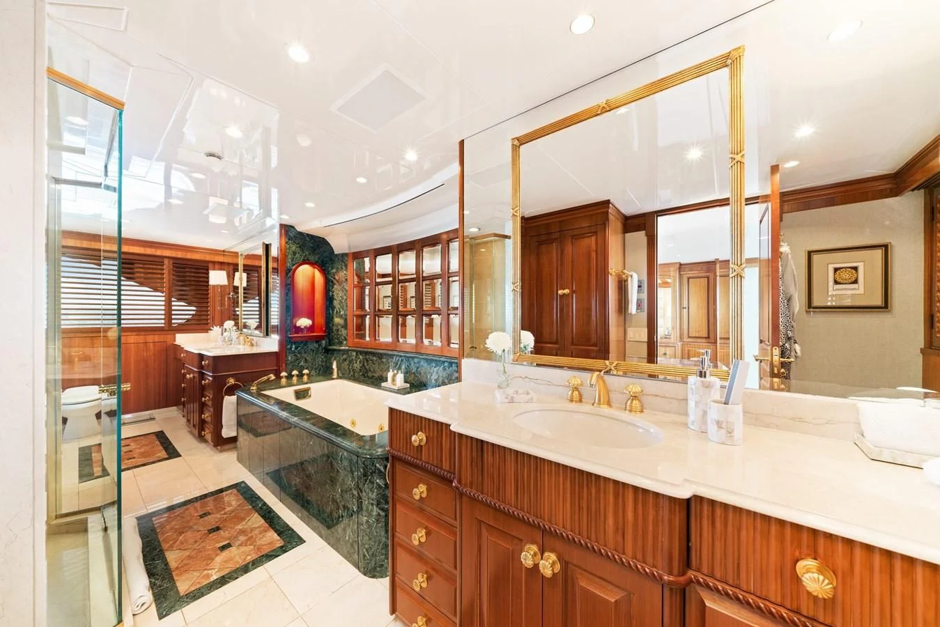 a bathroom with a large mirror aboard PACKAGE DEAL Yacht for Charter