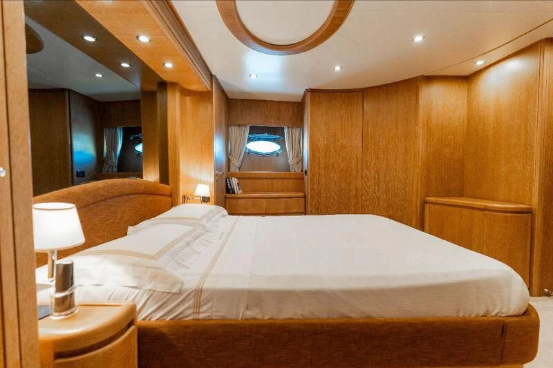 a bed with a white sheet aboard WARLOCK Yacht for Sale
