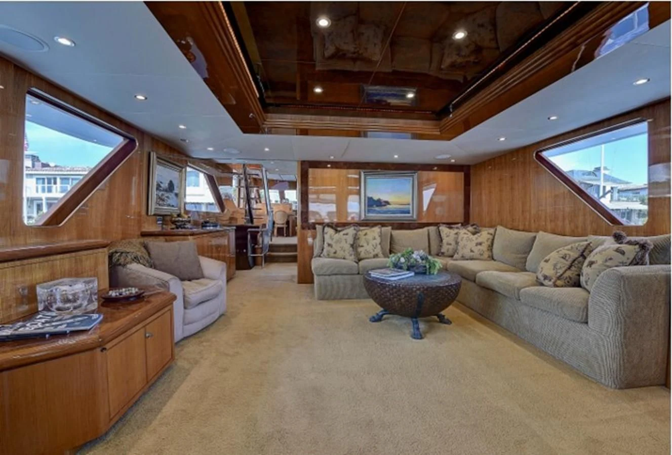 a living room with a couch and a table aboard ANACAPA Yacht for Sale