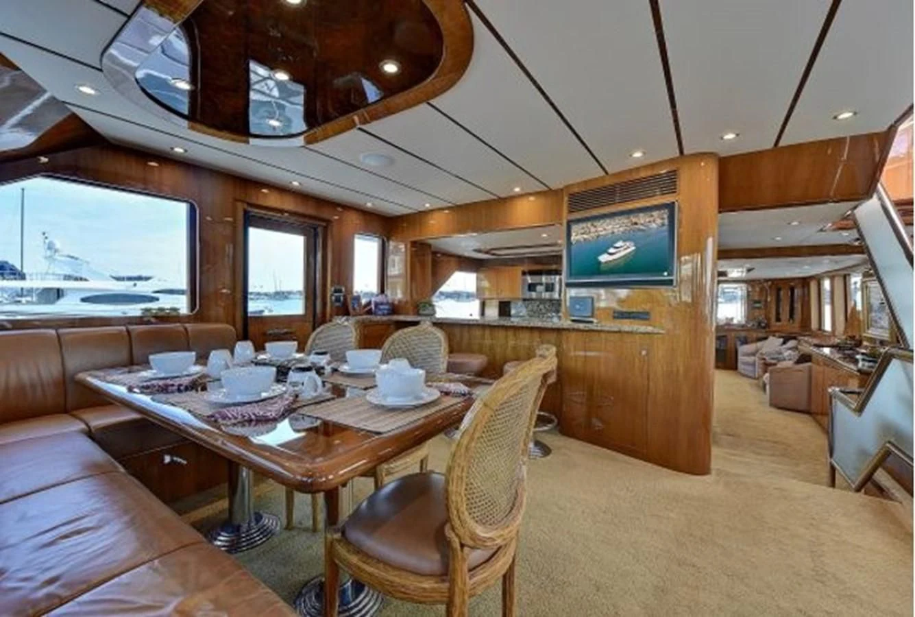 a large room with a table and chairs aboard ANACAPA Yacht for Sale