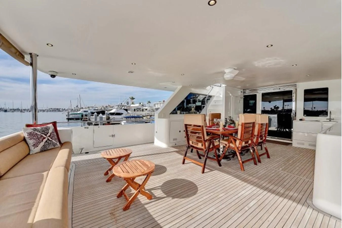 a living room with a large white sofa and chairs aboard ANACAPA Yacht for Sale