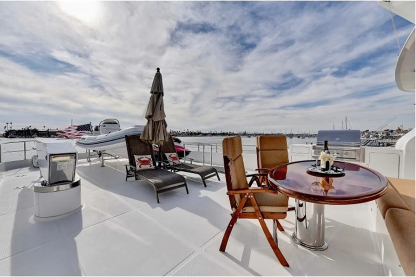 a table and chairs on a deck aboard ANACAPA Yacht for Sale