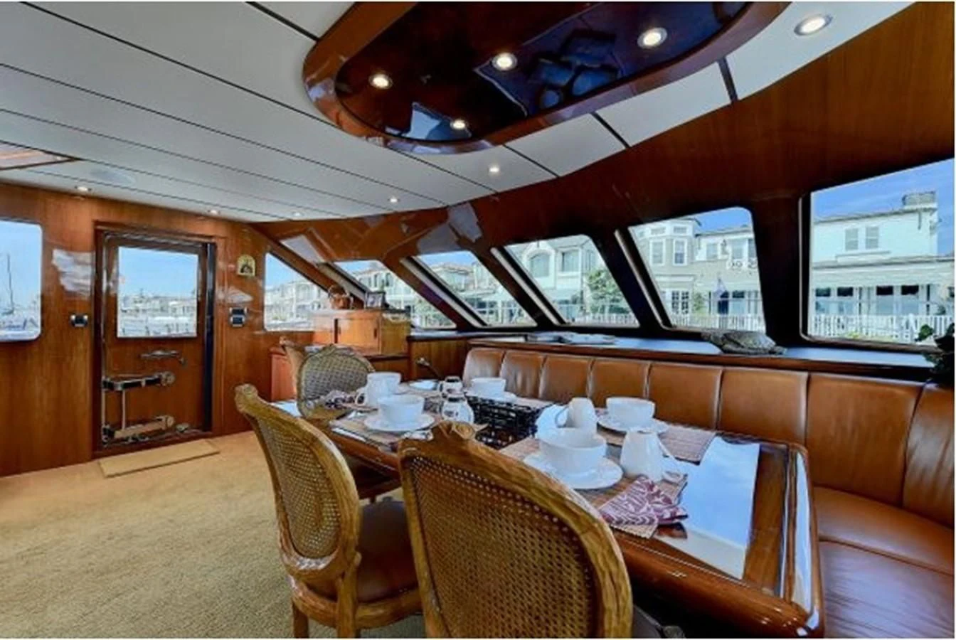 a dining room with a table and chairs aboard ANACAPA Yacht for Sale