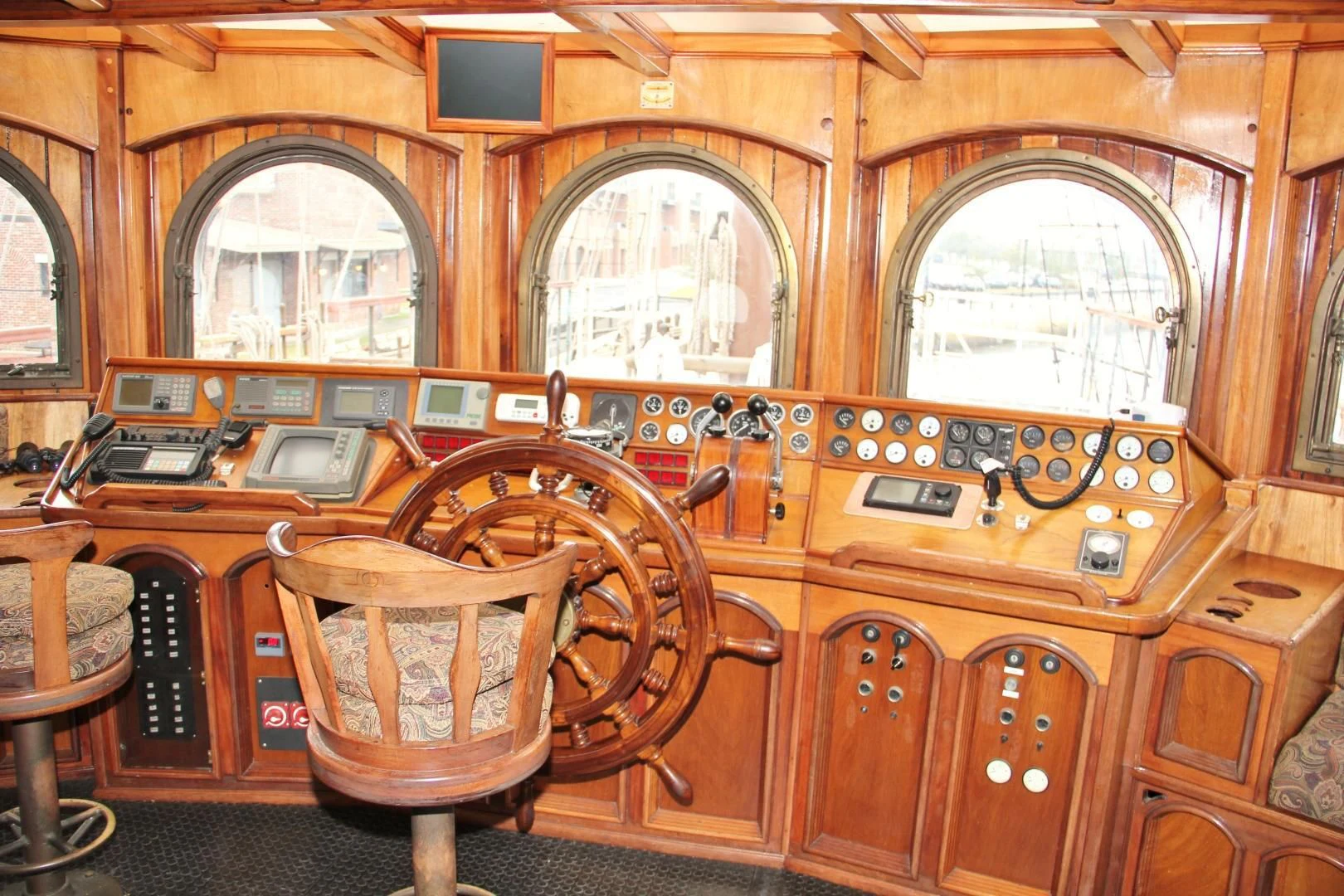 a large wooden piano aboard PEACEMAKER Yacht for Sale