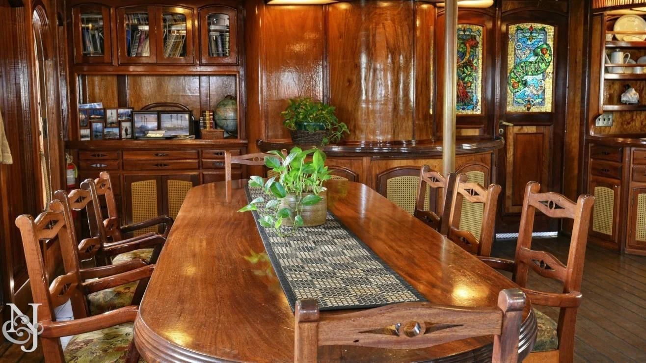 a dining room table aboard PEACEMAKER Yacht for Sale