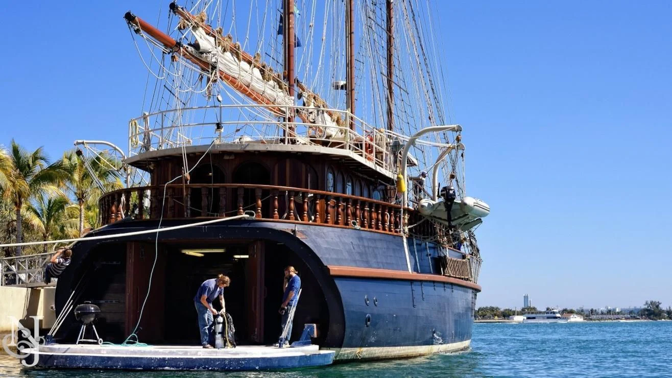 a large ship with people standing on it aboard PEACEMAKER Yacht for Sale