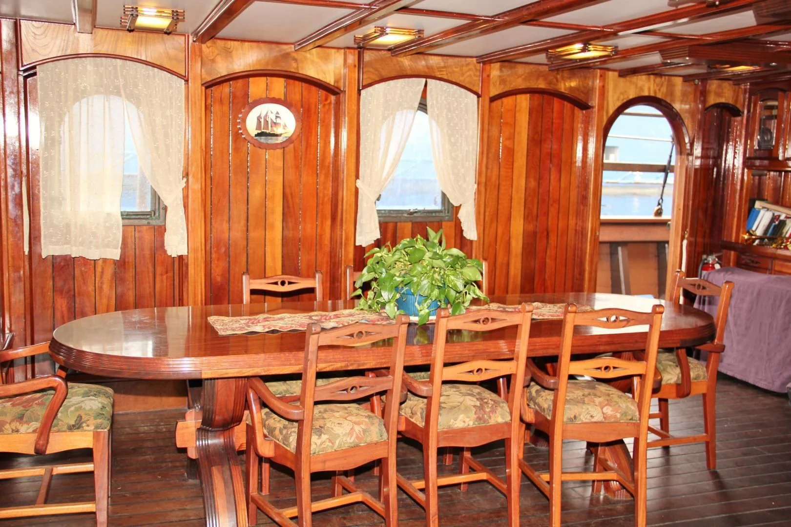 a dining room with a table and chairs aboard PEACEMAKER Yacht for Sale