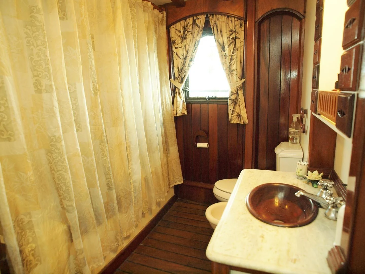 a bathroom with a sink and toilet aboard PEACEMAKER Yacht for Sale