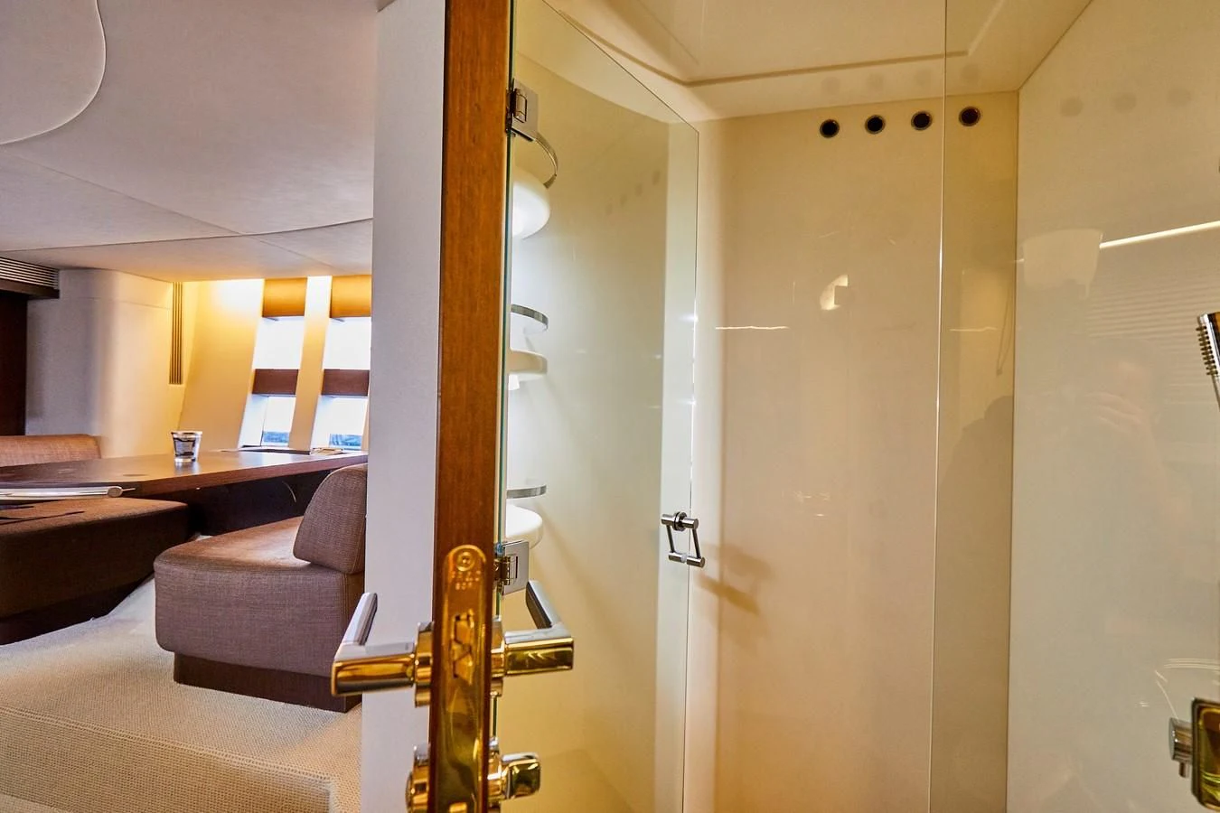 a room with a table and a couch aboard BLACK ICE Yacht for Sale