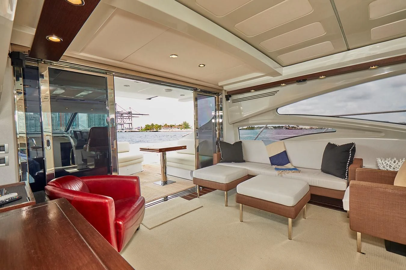 a living room with a large glass door aboard BLACK ICE Yacht for Sale