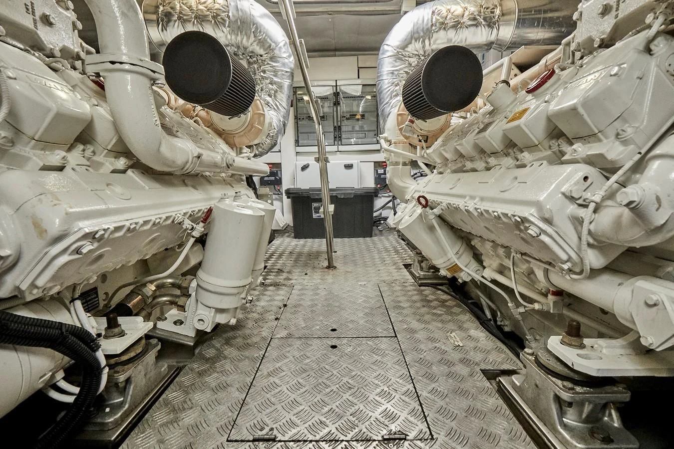 a room with a large group of white pipes and pipes aboard BLACK ICE Yacht for Sale
