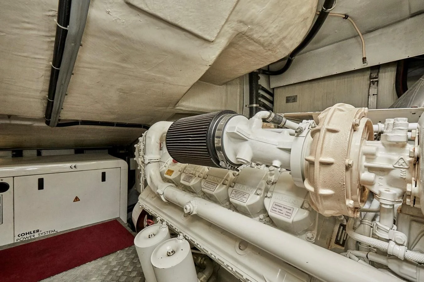 a white machine in a room aboard BLACK ICE Yacht for Sale