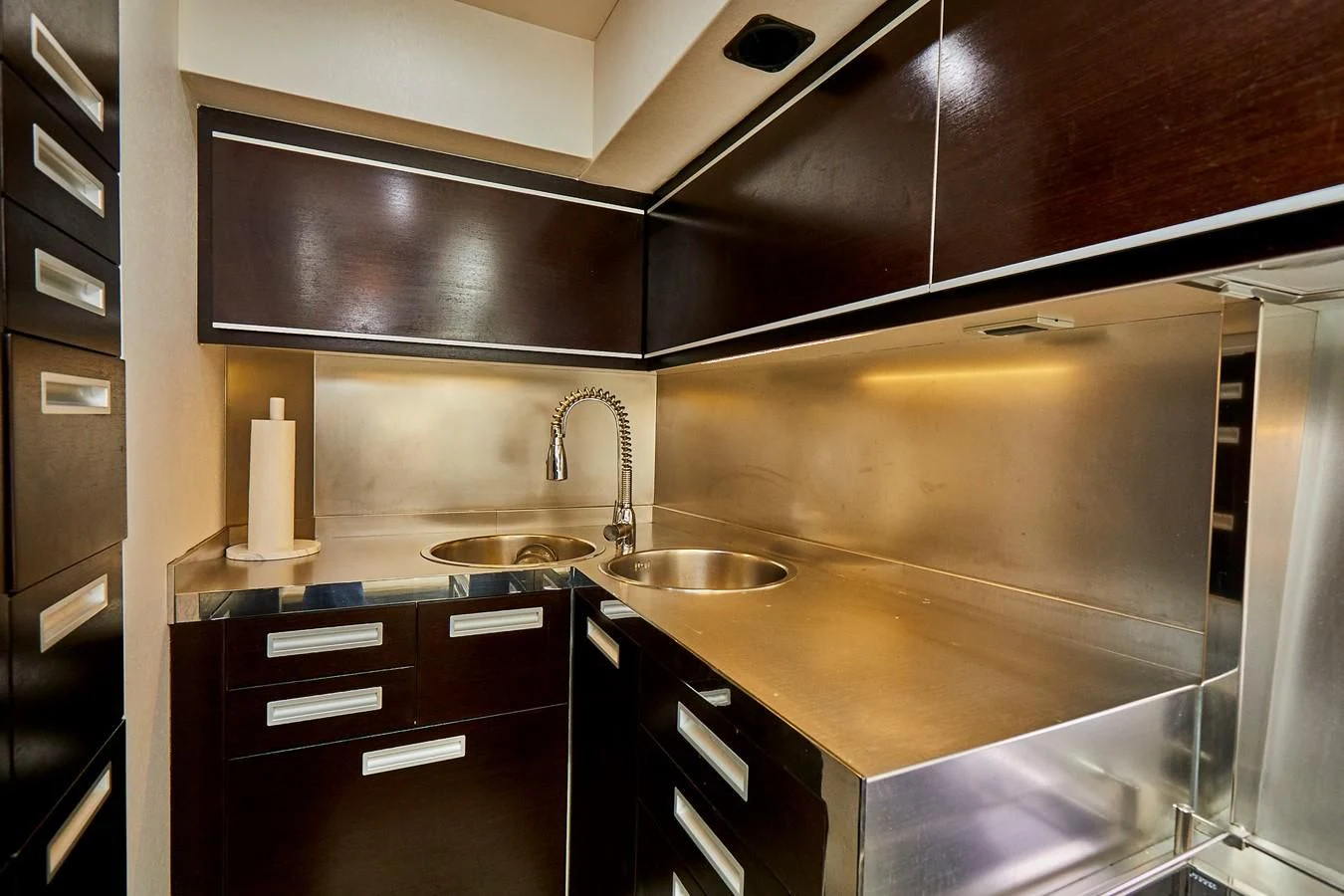 a kitchen with a sink and cabinets aboard BLACK ICE Yacht for Sale