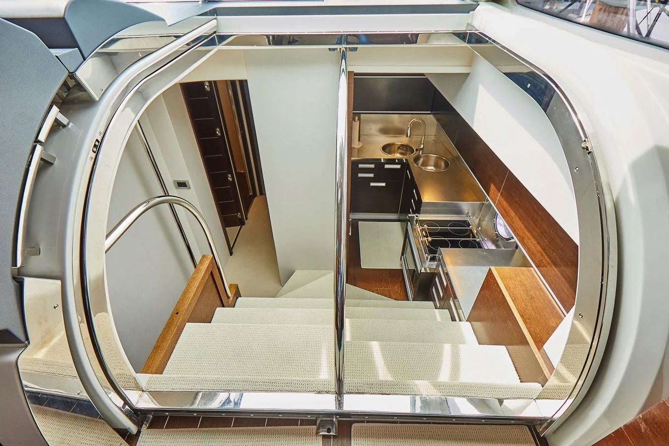 a staircase with a glass case aboard BLACK ICE Yacht for Sale