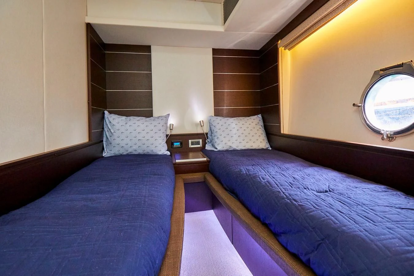 a couple of beds in a hotel room aboard BLACK ICE Yacht for Sale