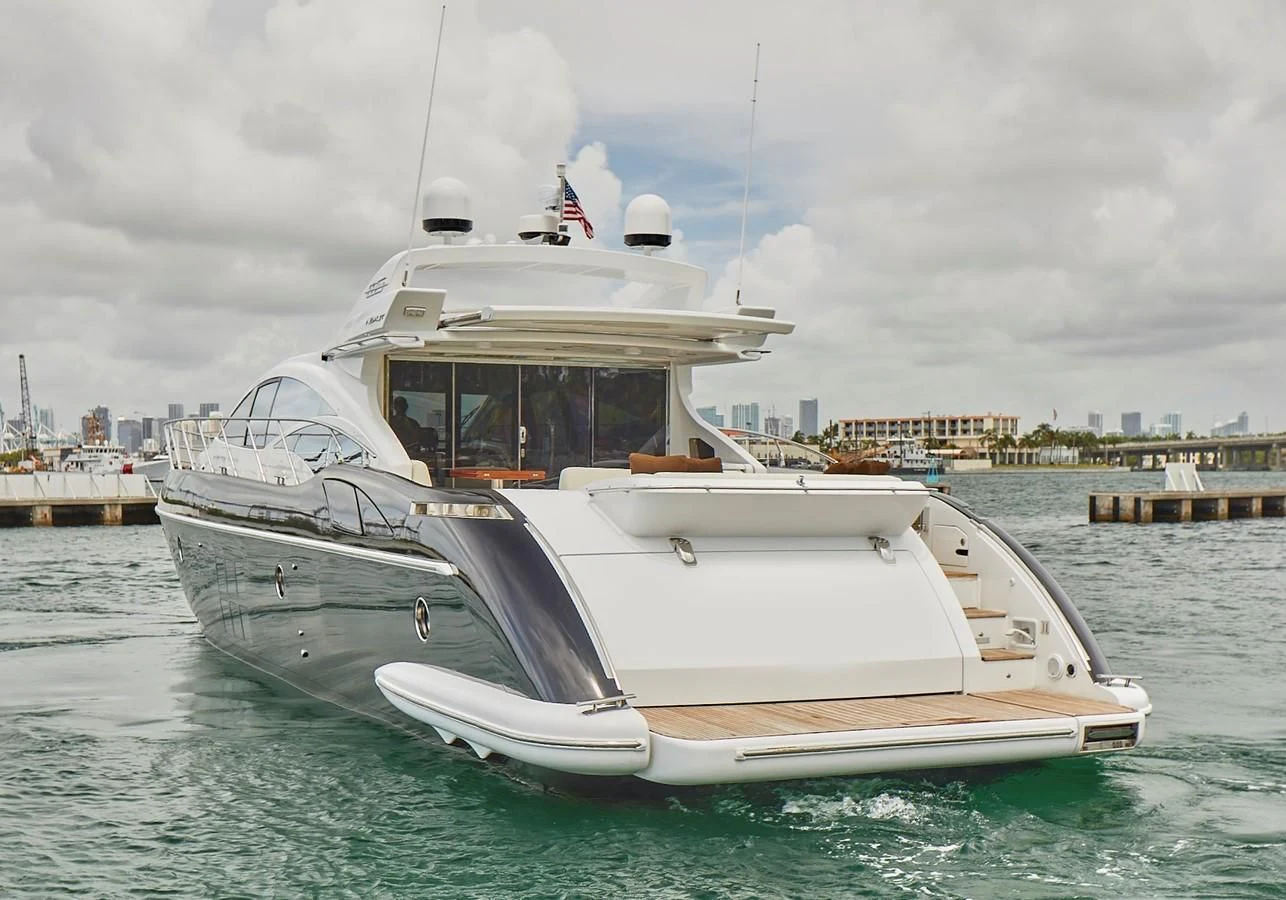a white yacht in the water aboard BLACK ICE Yacht for Sale