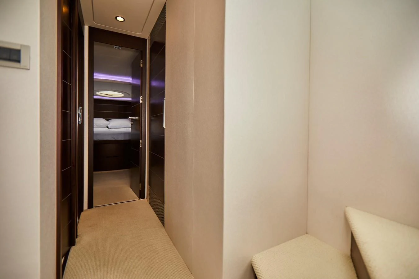 a room with a bed and a closet aboard BLACK ICE Yacht for Sale