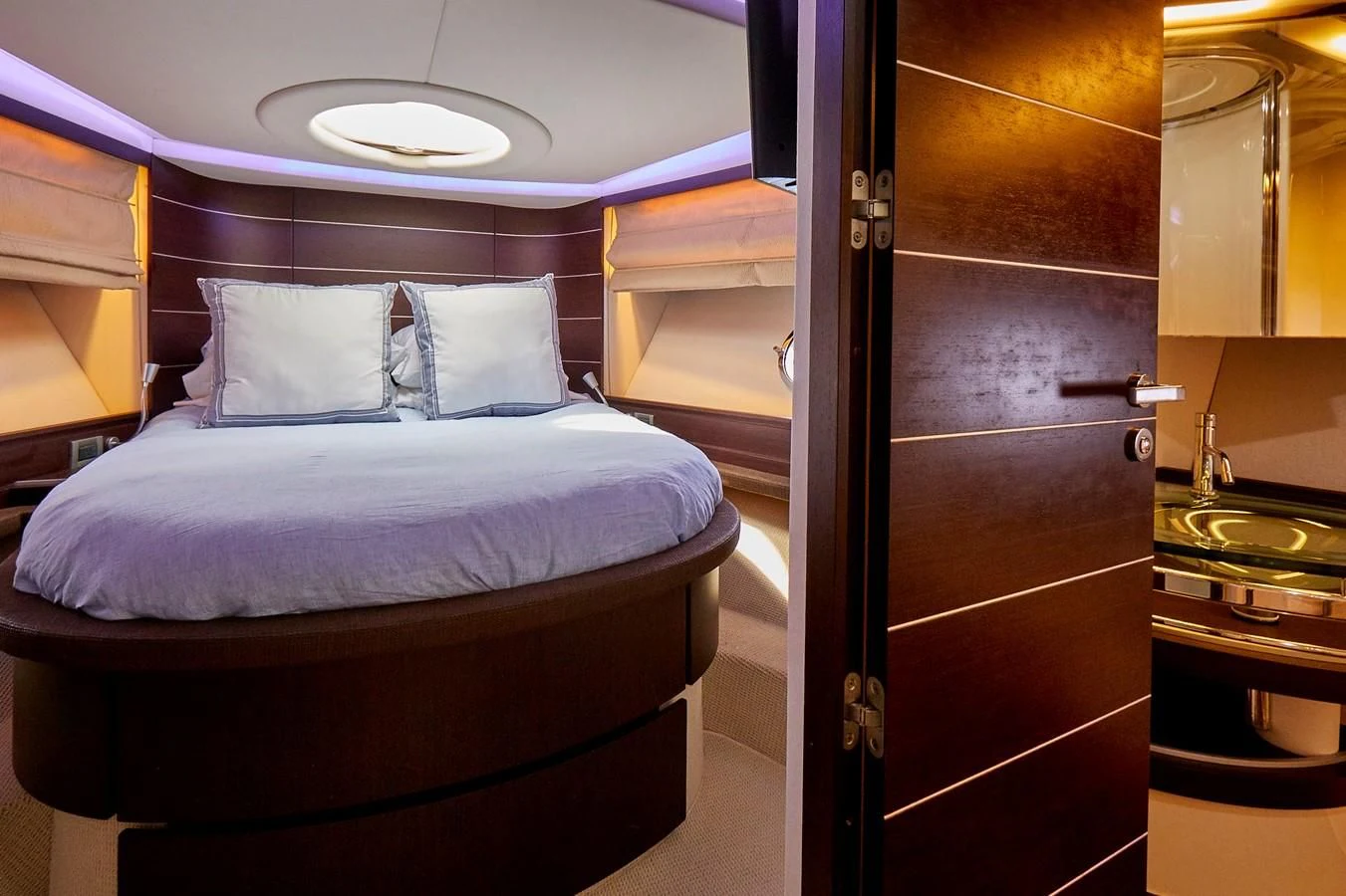 a bed in a room aboard BLACK ICE Yacht for Sale