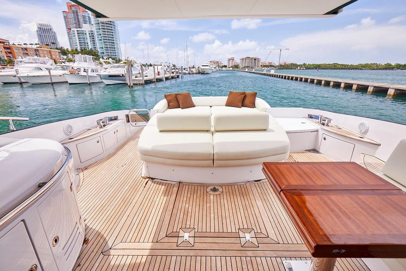 a deck with a view of a city and boats in the water aboard BLACK ICE Yacht for Sale
