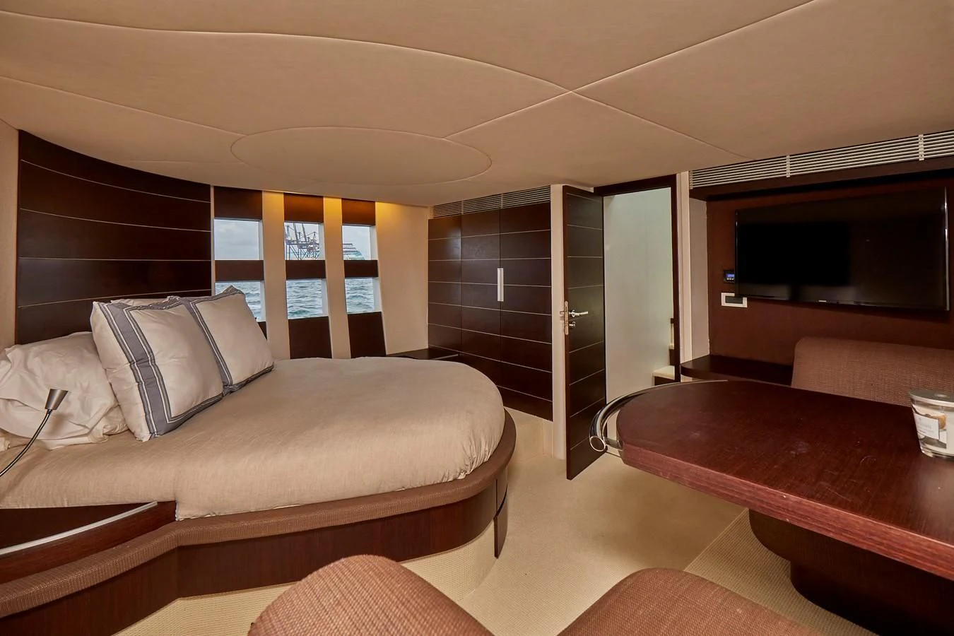 a room with a bed and a tv aboard BLACK ICE Yacht for Sale