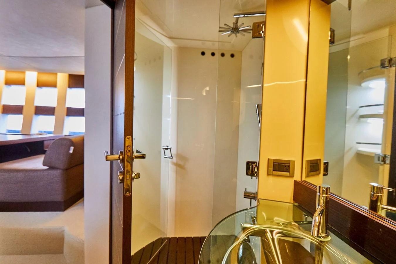 a room with a glass door and a couch aboard BLACK ICE Yacht for Sale
