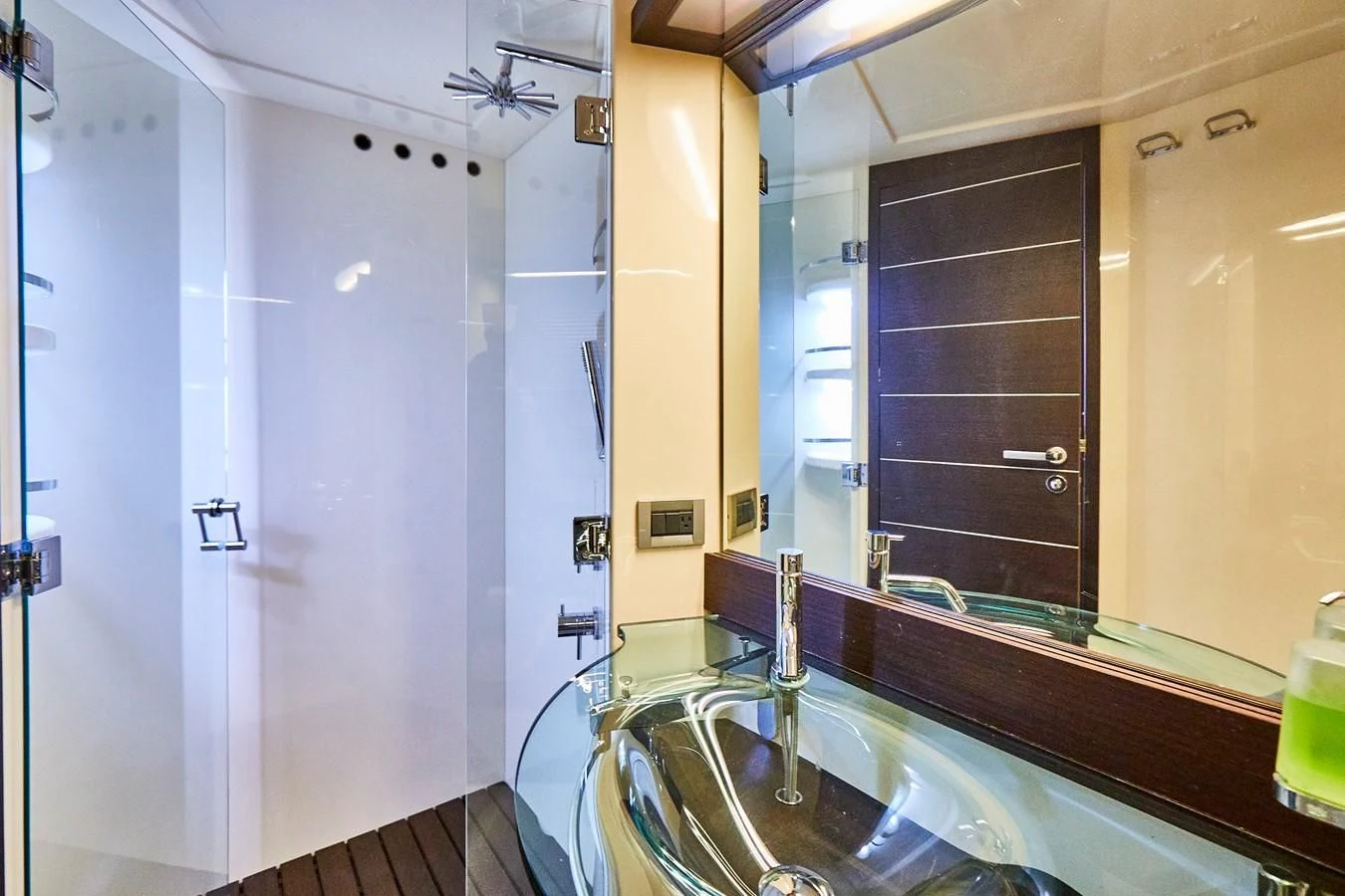 a bathroom with a large mirror aboard BLACK ICE Yacht for Sale