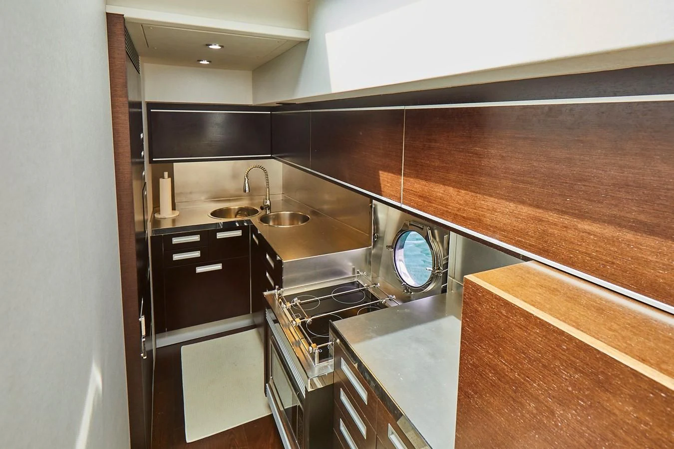 a kitchen with a sink and a fan aboard BLACK ICE Yacht for Sale