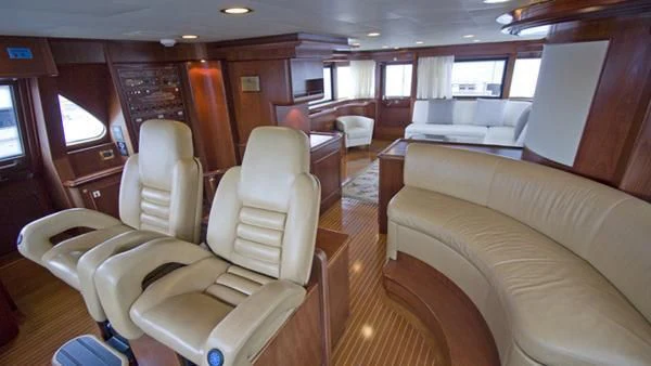 a room with a couch and a bed aboard MALUHEA Yacht for Sale