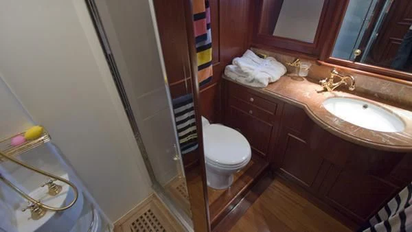 a bathroom with a sink and a toilet aboard MALUHEA Yacht for Sale