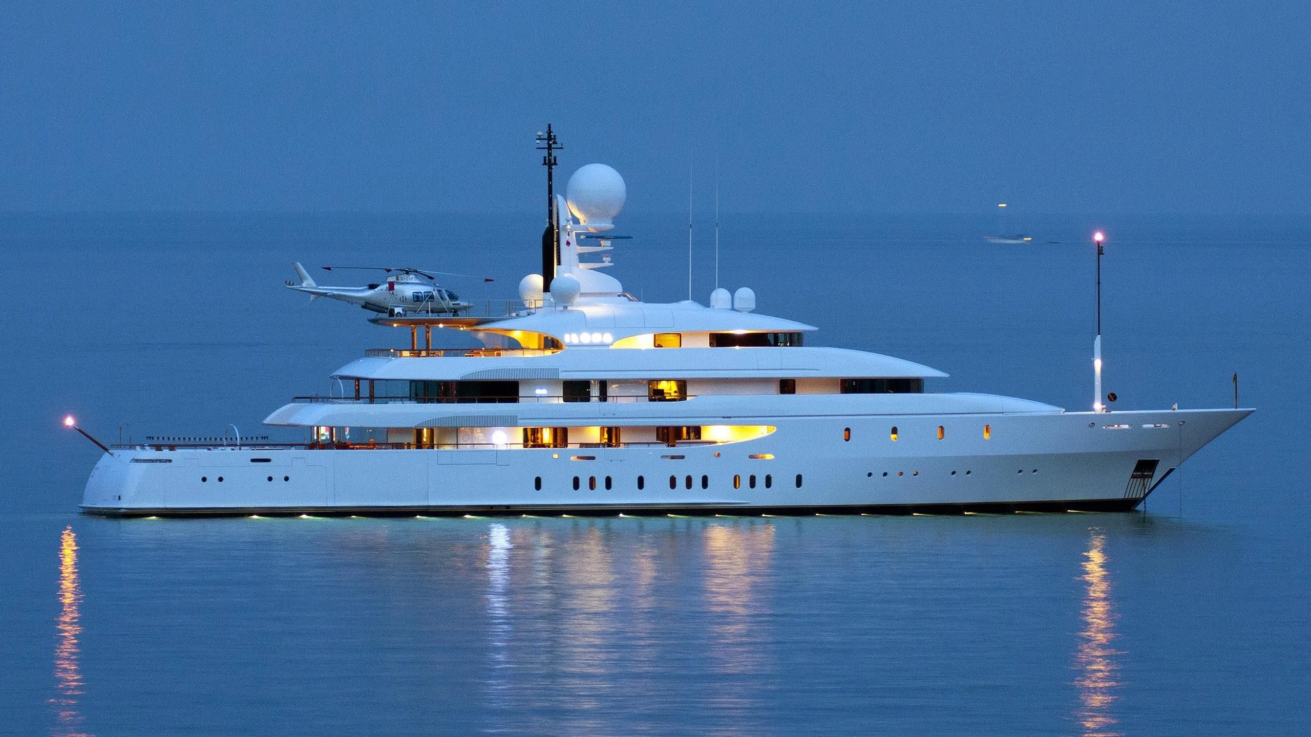 a large white ship with a helicopter on it aboard ILONA Yacht for Sale