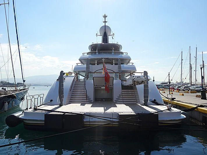 a large white boat in a harbor aboard ILONA Yacht for Sale