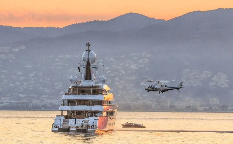 a helicopter flying over a ship aboard ILONA Yacht for Sale