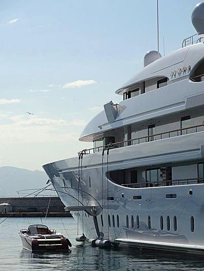 a large cruise ship docked aboard ILONA Yacht for Sale