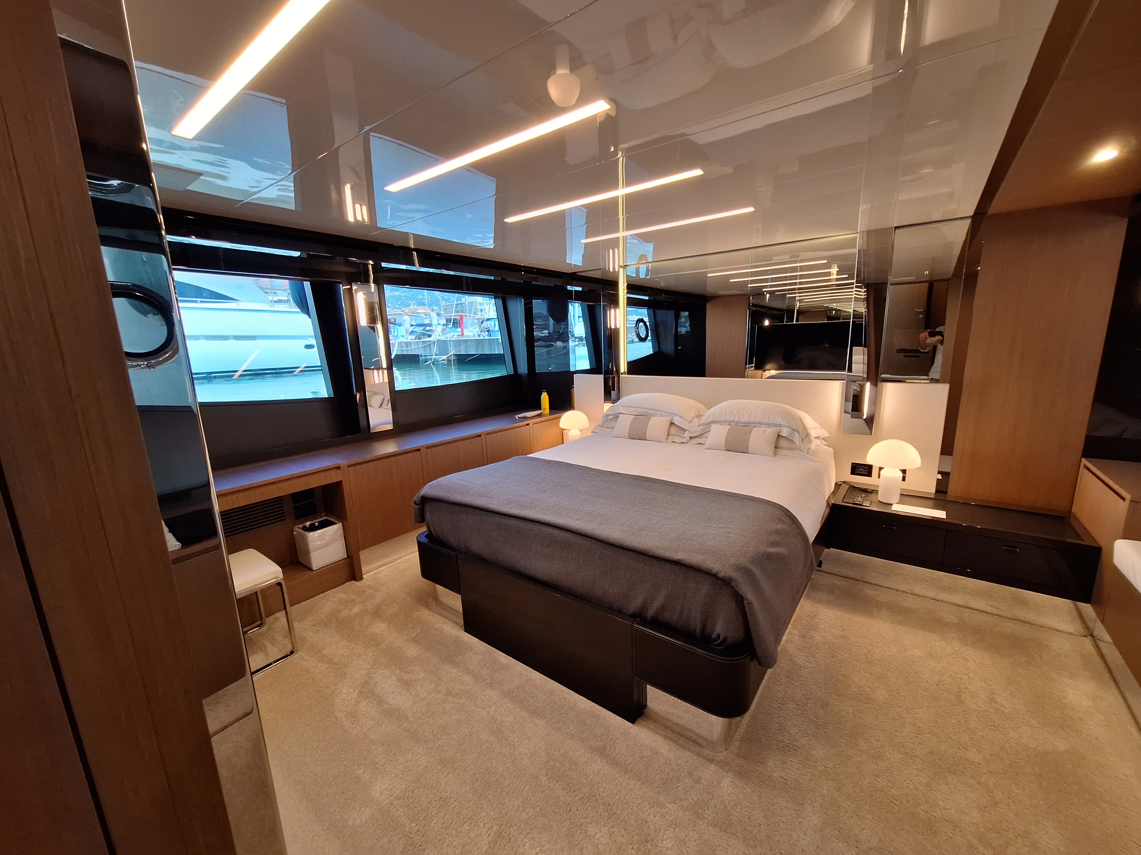 a room with a bed and a desk aboard CHILUCE Yacht for Charter