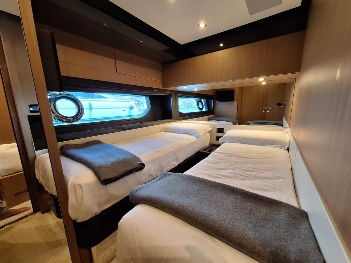 a room with two beds aboard CHILUCE Yacht for Charter