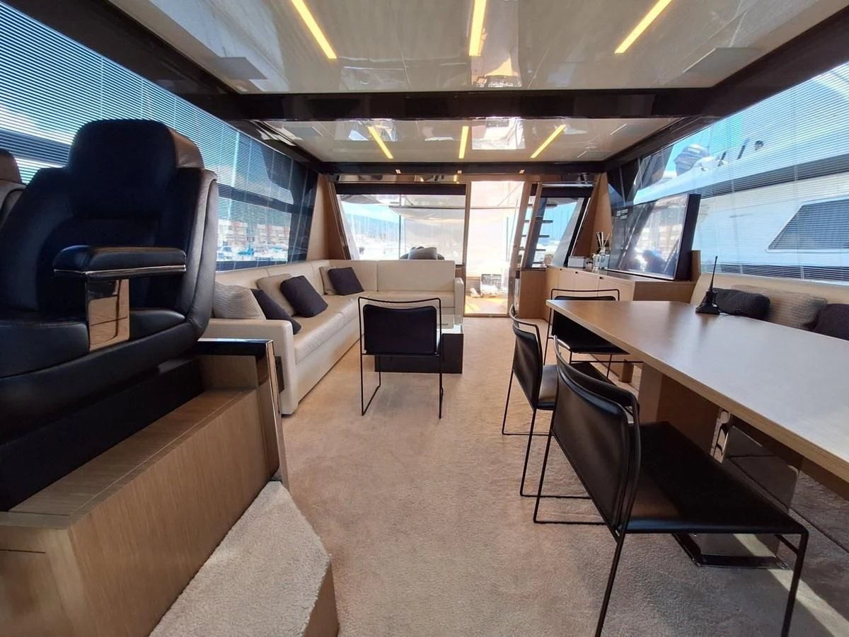 a room with chairs and tables aboard CHILUCE Yacht for Charter