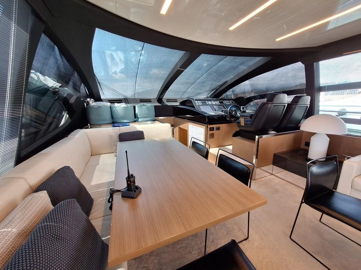 a room with a table and chairs aboard CHILUCE Yacht for Charter