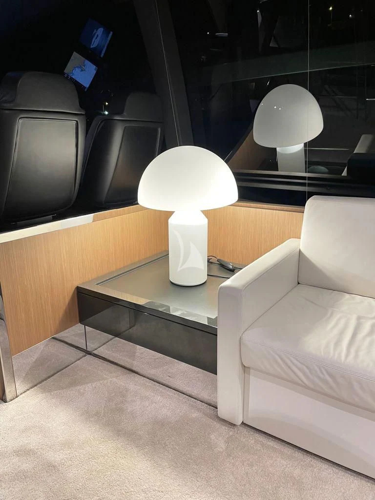 a white couch in a room aboard CHILUCE Yacht for Charter