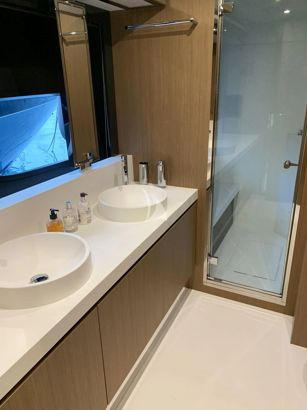 a bathroom with a large mirror aboard CHILUCE Yacht for Charter