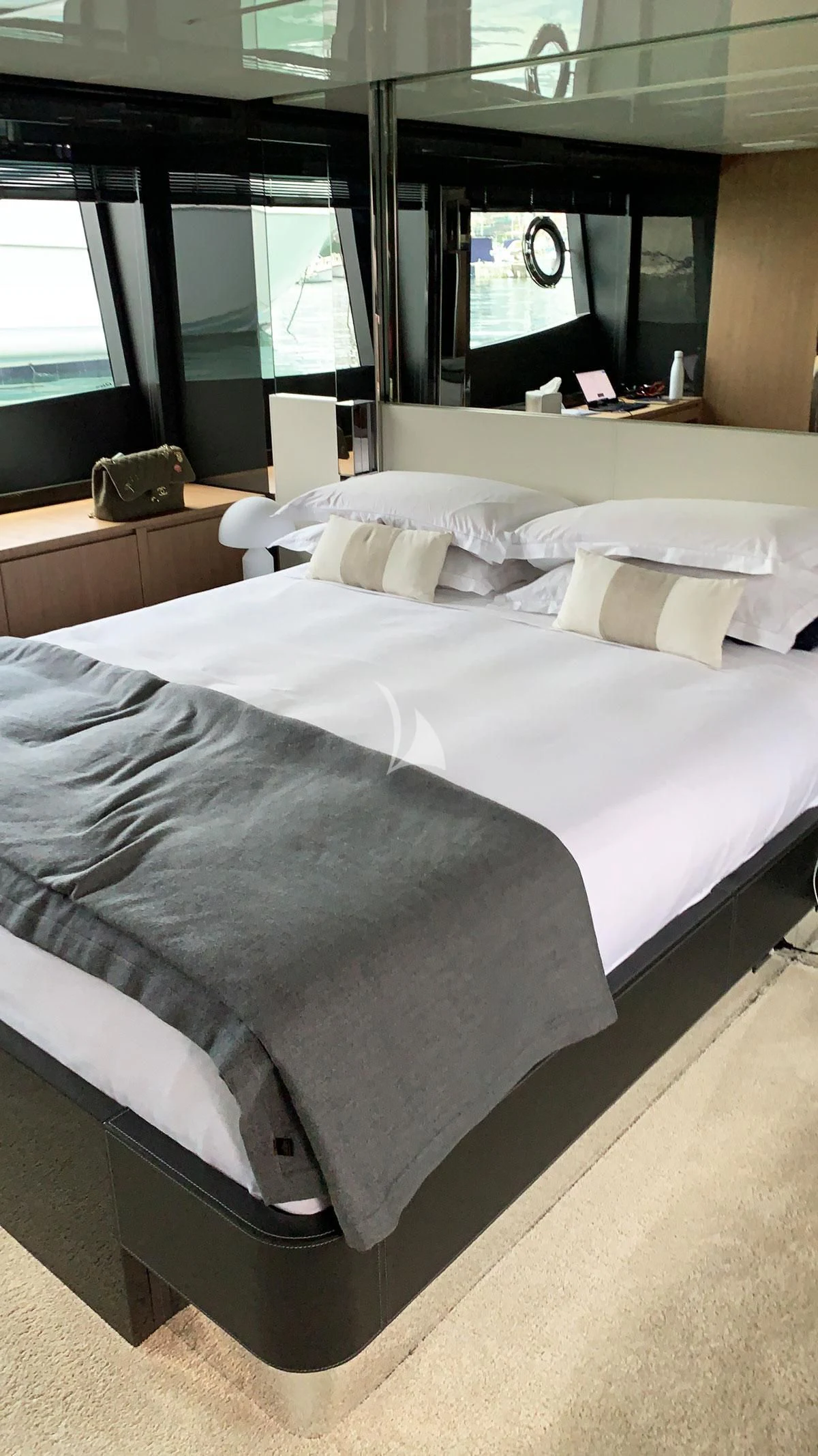 a bed with white sheets aboard CHILUCE Yacht for Charter