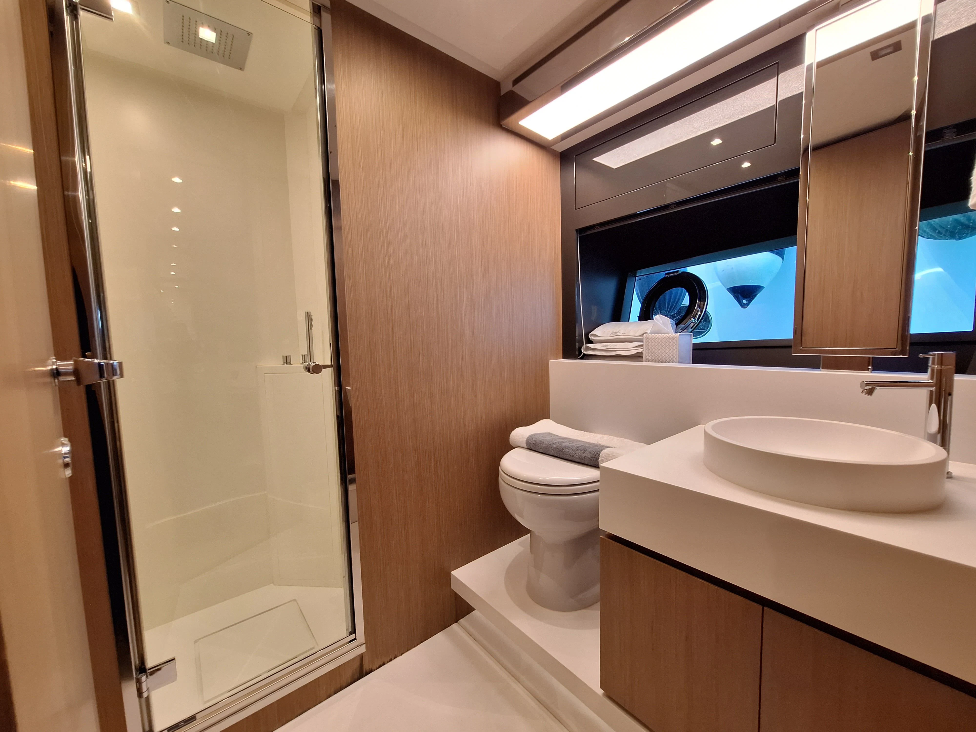 a bathroom with a large mirror aboard CHILUCE Yacht for Charter
