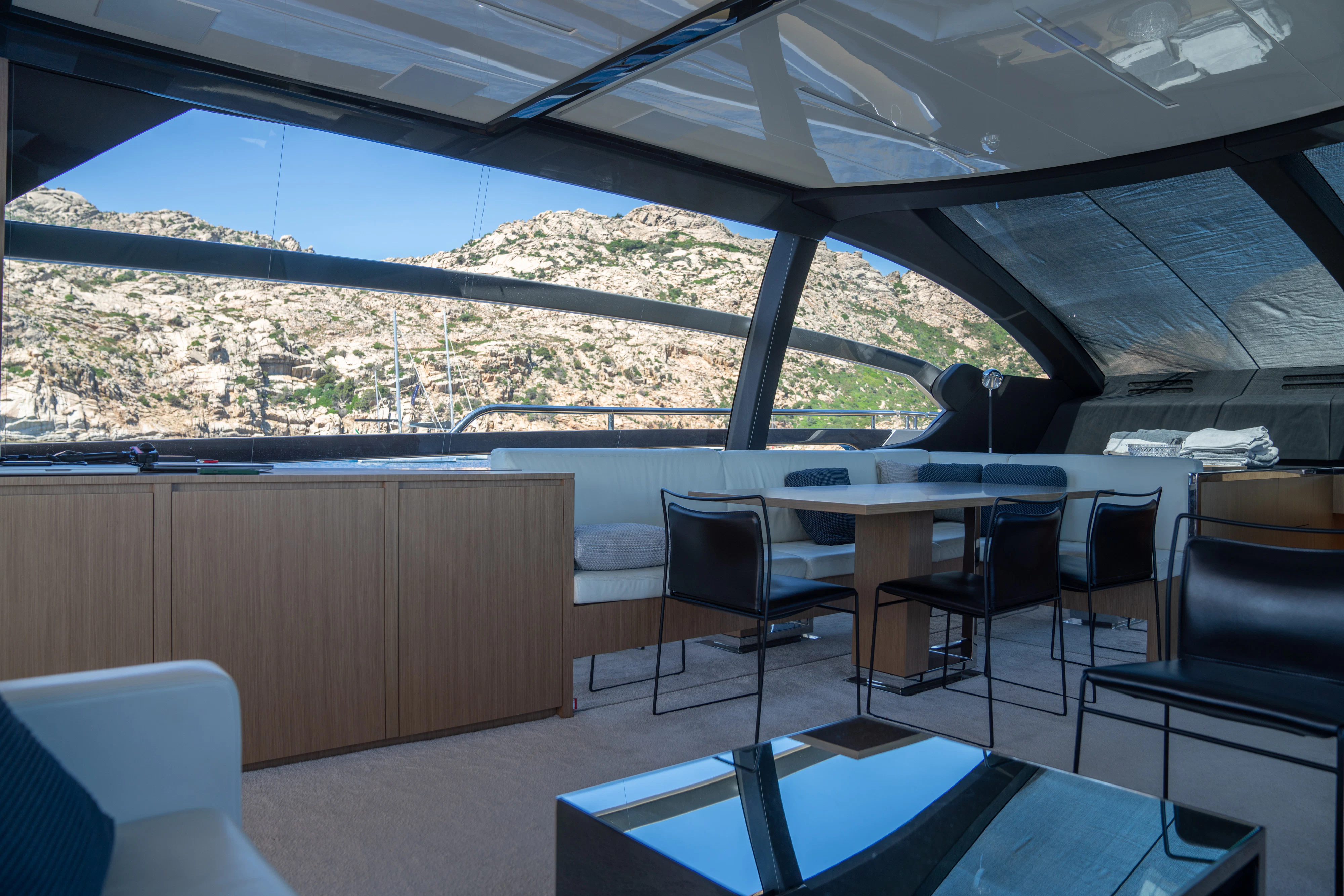 a room with a table and chairs aboard CHILUCE Yacht for Charter