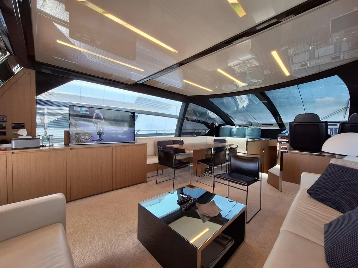 a room with a table and chairs aboard CHILUCE Yacht for Charter