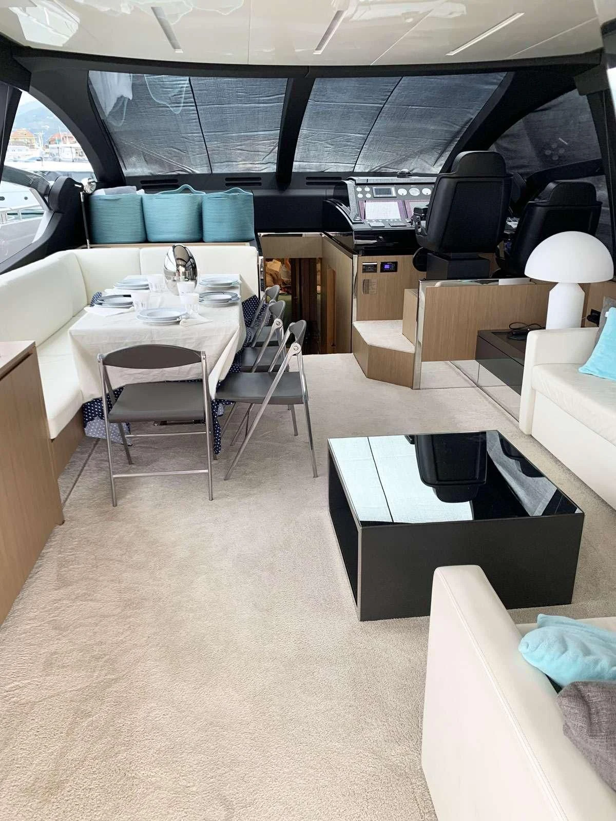 a room with a table and chairs aboard CHILUCE Yacht for Charter