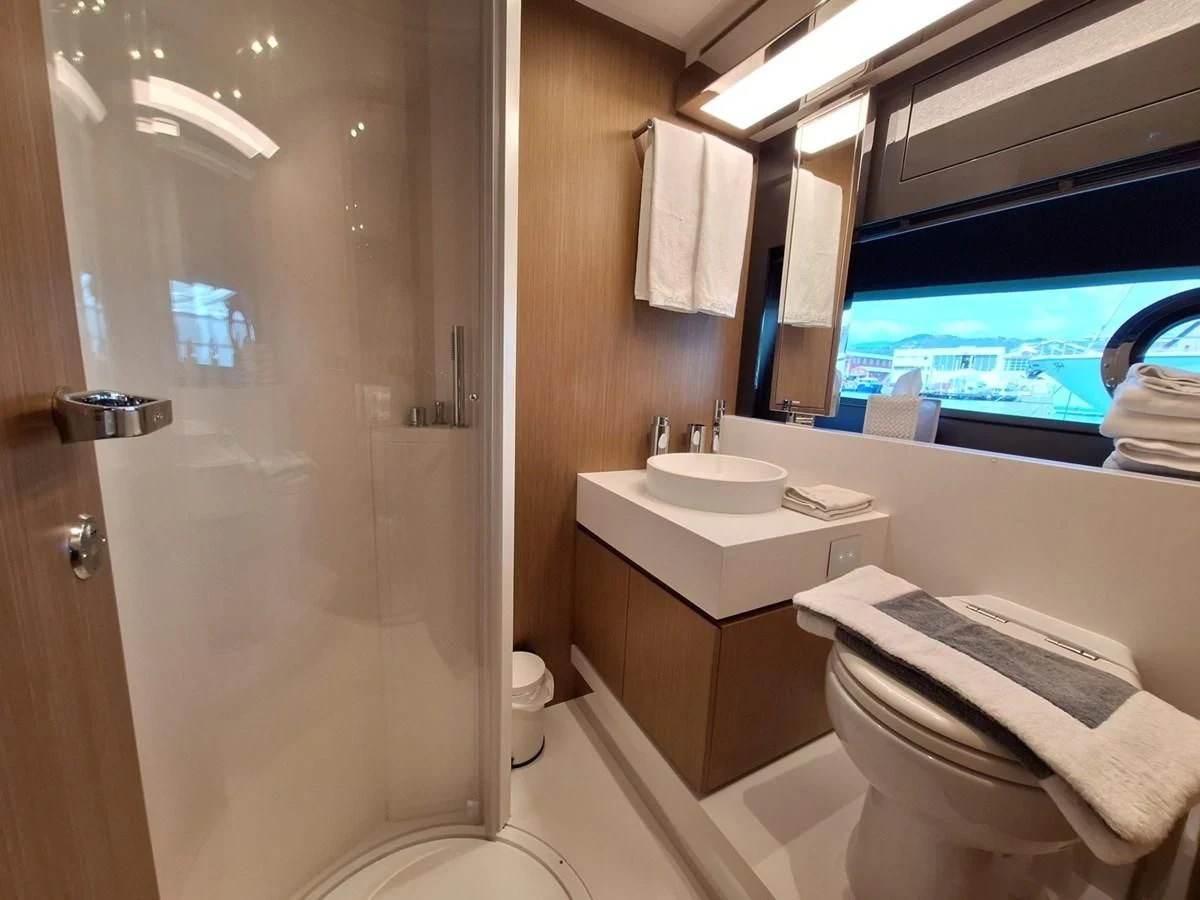 a bathroom with a sink and a mirror aboard CHILUCE Yacht for Charter