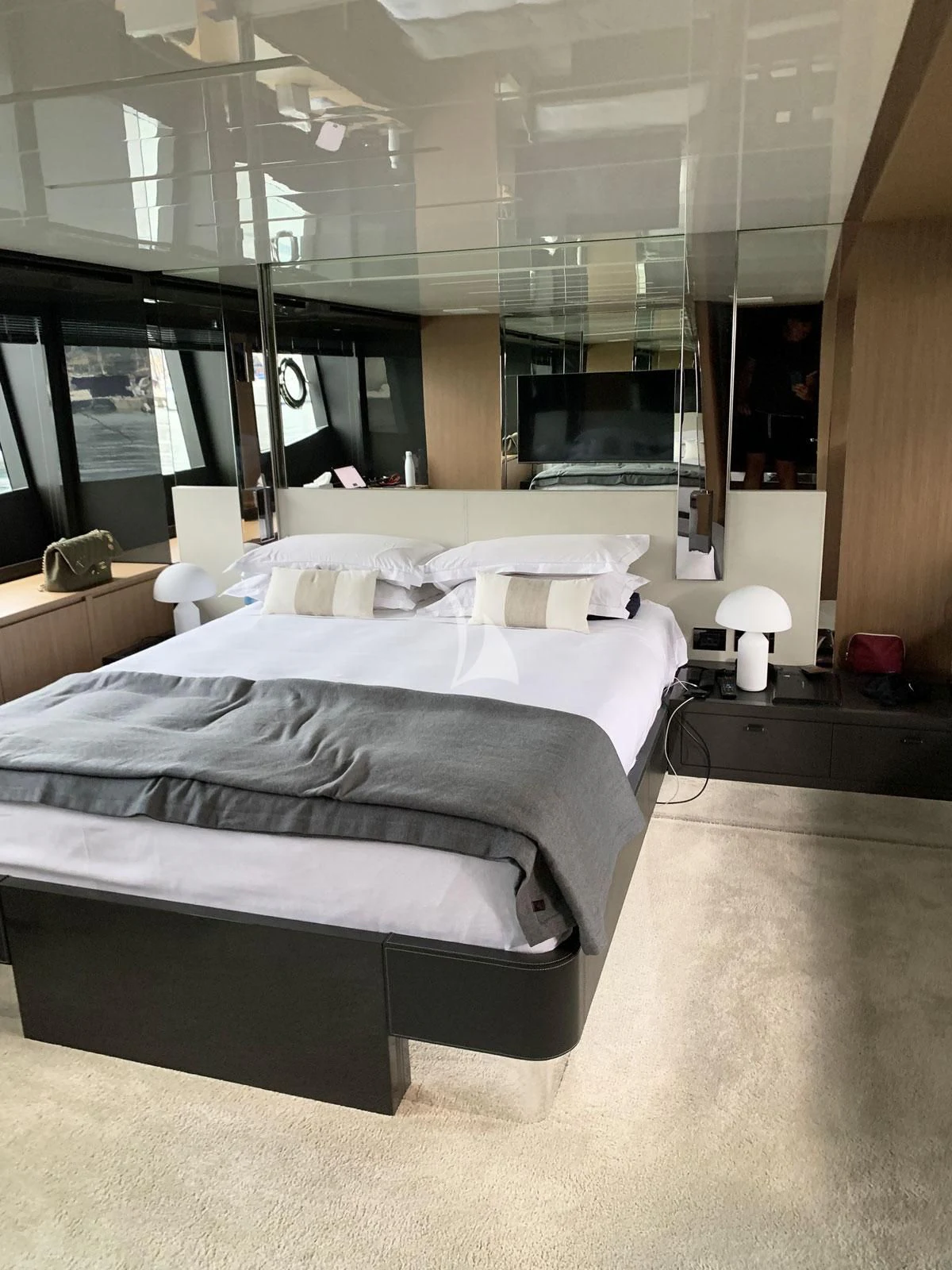a room with a bed and a window aboard CHILUCE Yacht for Charter