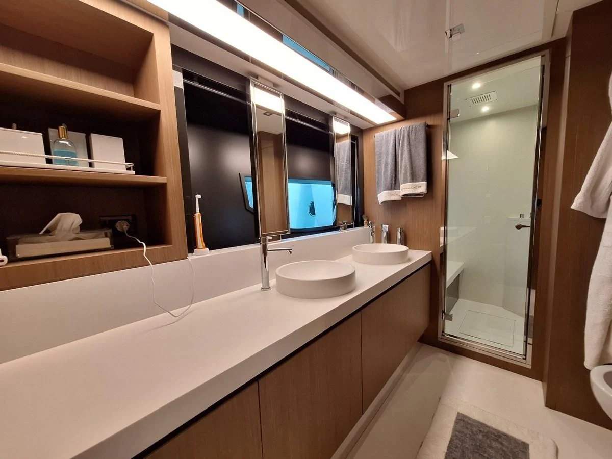 a bathroom with sinks and mirrors aboard CHILUCE Yacht for Charter