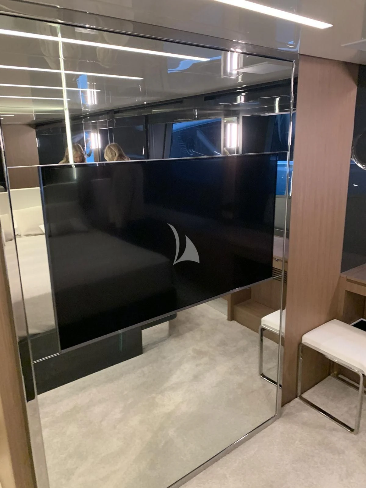 a black couch in a room aboard CHILUCE Yacht for Charter