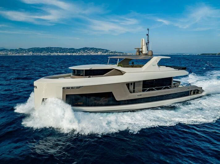 a large white boat on the water aboard WATERLILY Yacht for Sale