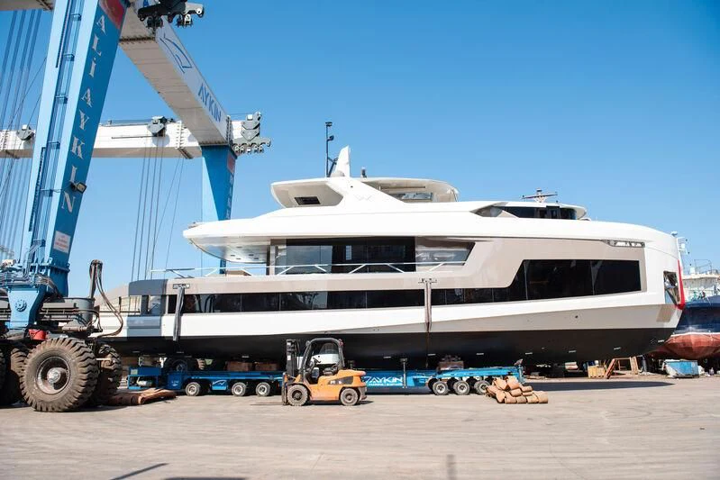 a large white boat sits in a dock aboard WATERLILY Yacht for Sale